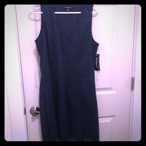 Mid length navy eyelet dress.